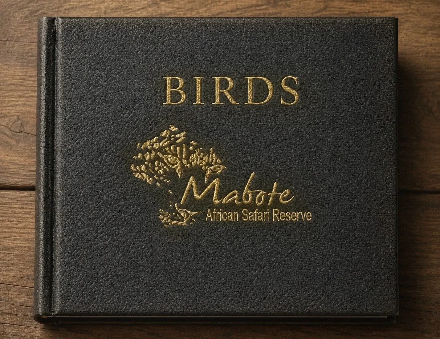 Leather-bound 'Birds' photo album embossed in gold with the Mabote African Safari Reserve crest